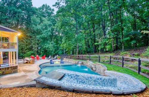 Flowery Branch Casa | Lakefront, Saltwater Pool, Backyard Oasis, Private Dock, Home Gym