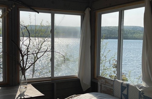Rome Cabina | Lakeside Lodging, Elevated - Walk to Village shops and restaurants and enjoy a private lakefront, newly renovated and furnished 1843 home!