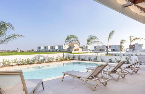 Softades Casa | Larnaca Blue 16 is a contemporary villa on a gated complex.