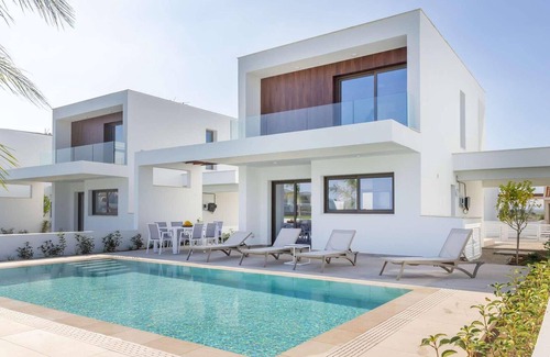 Softades Casa | Larnaca Blue 16 is a contemporary villa on a gated complex.