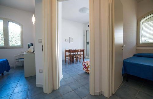 Torre Suda Apartamento | Le Bianche ville con patio privato a un passo dal mare
