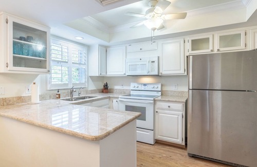 Moorings Condominio | Less than 2 miles to the beach! West of 41 condo with pool and hot tub!