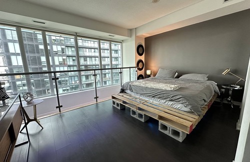 King West Village Condominio | Liberty Village charm, vibrant community, and a spacious loft await your stay!