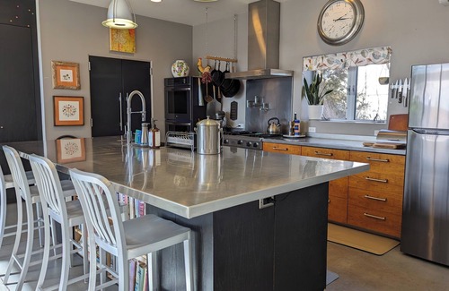 La Cienaga Casa | Light-filled main house close to town; views, hiking on high desert behind house