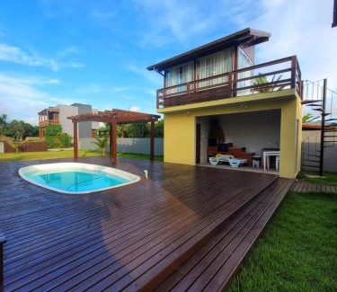 Ibiraquera Casa | LINDA CASA COM PISCINA DE FRENTE PARA A LAGOA