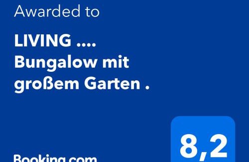 Halver Apartamento | LIVING . Bungalow mit großem Garten .