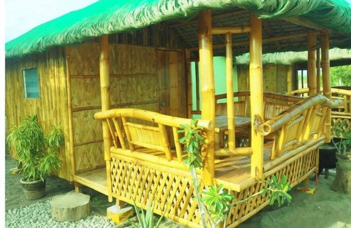 Bacnotan Cabaña | Local style cottage in a garden setting - cosy comfort with A/C