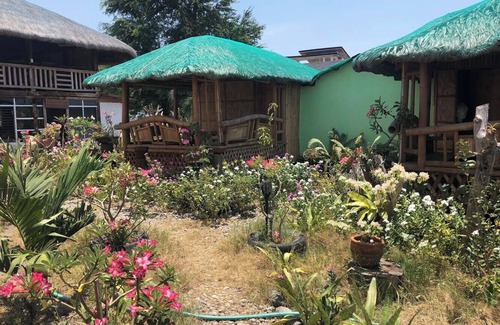 Bacnotan Cabaña | Local style cottage in a garden setting - cosy comfort with A/C