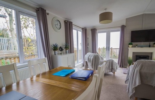 Corton Cabina | Lodge with decking and sea views at Azure Seas Park in Suffolk ref 32212OG