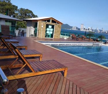 Pioneiros Apartamento | LOFT com garagem e piscina Prédio frente MAR