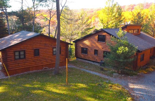 Windermere Cabaña | Log home & guest cottage in old forest, Waterfall, Sunsets, Sauna, Fishing Boat