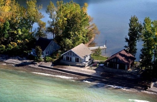 Wolcott Cabaña | Señuelo Cottage, justo en la haya. Palmeras, lancha motora gratuita.