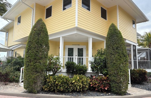 Palm City Casa | Lush Waterfront Pool Home and Pool house with Pickleball court and Boat dock