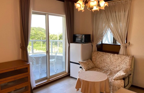 Hamada Casa | Luxrious double room with mountain view and ocean view from the balcony and an interior window/Hamada Shimane