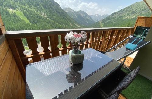 Isola Apartamento | Luxueux appartement au centre, 2 chambres, commerces et pistes à pieds, vue panoramique terrasse ensoleillée, parking, prestations haute qualité