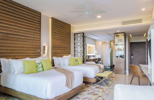 Puerto Juárez Hotel | Luxurious 2-bedroom swim-up suite at Garza Blanca's 5 Diamond Resort.