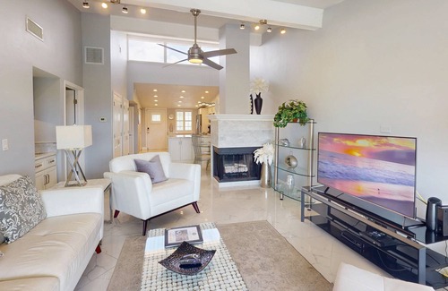 Capri Isle Condominio | Luxurious Coastal Condo with Waterway Views, Pool, Balcony, and Steps to Treasure Island Beach.