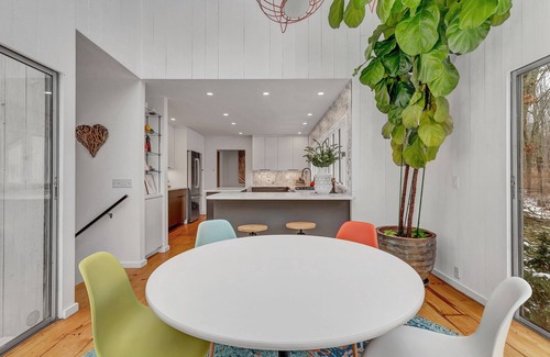 Old Lyme Casa | Luxurious midcentury modern glass house in the woods, chefs kitchen & great art