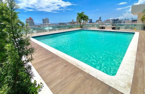 Downtown Santo Domingo Condominio | Luxurious One Bedroom Apt, King Bed, Full AC, Rooftop Lounge and Pool, Gym...