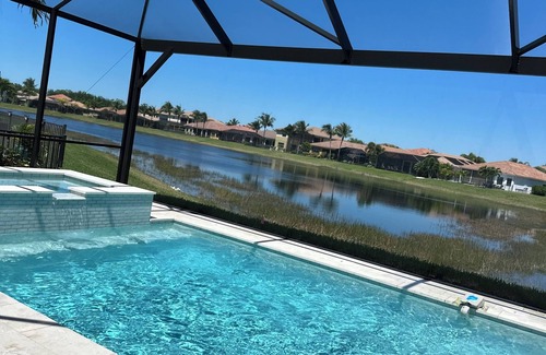 Naples Casa | LUXURIOUS OPEN CONCEPT WATERFRONT HOME. 3 BED 3 BATH. PRIVATE HEATED POOL & SPA.