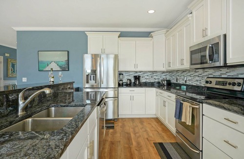 Sunset Beach Casa | Luxurious Sunset Beach Home On The Water With Pool, Boat Dock and Golf Cart