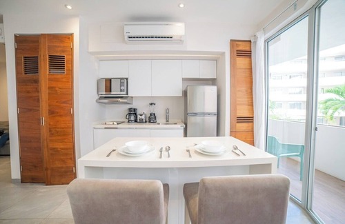 Área de la calle 12 Apartamento | Luxury 1BR with Stunning Poolside Terrace