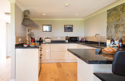 Wadebridge Apartamento | Apartamento de lujo con impresionantes vistas, estufa de leña, calefacción central y un jardín