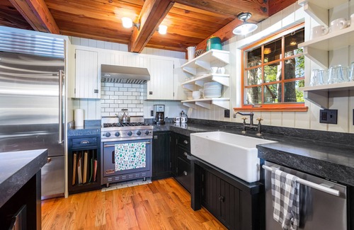 Serene Lakes Casa | Luxury lakefront home with private hot tub, on-site dock, fireplace & HOA beach