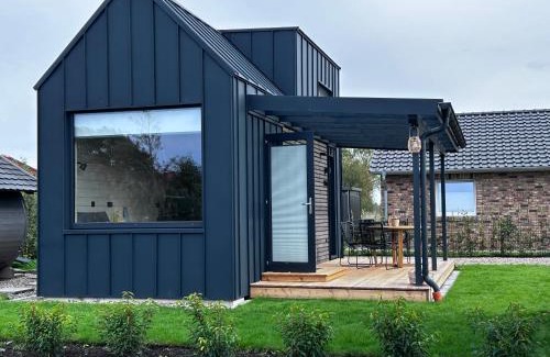 Sehestedt Casa | Lykke Huus Tinyhaus am Meer mit Fasssauna
