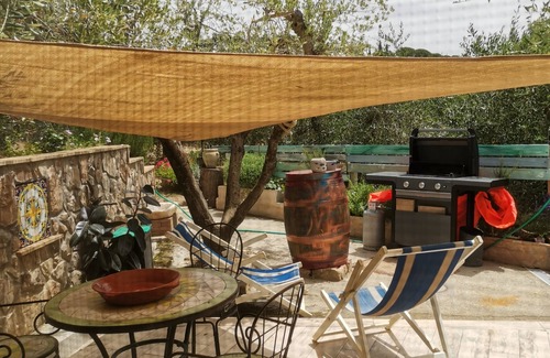 Orbetello Cabaña | Magnificent cottage surrounded by olive trees and aromatic plants.