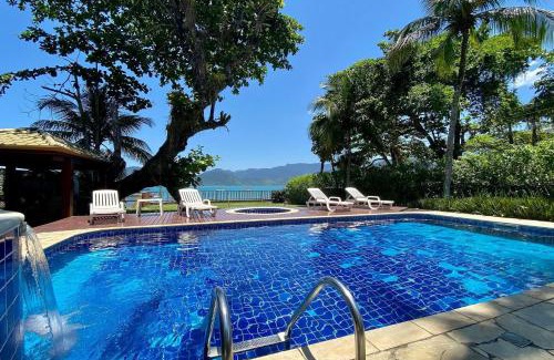 Lazaro Casa | Magnífica casa pé na areia 4 suítes c/ar e piscina