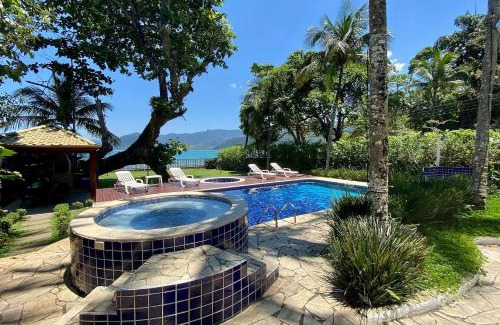 Lazaro Casa | Magnífica casa pé na areia 4 suítes c/ar e piscina