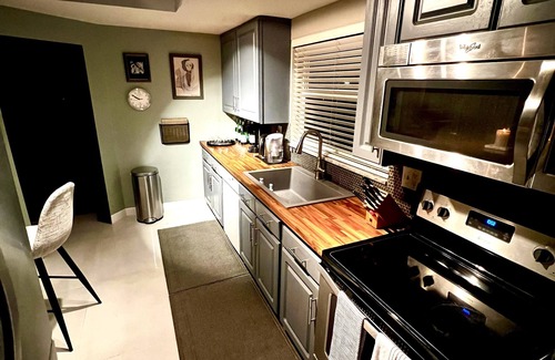 Coral Ridge Isles Casa | Maison Gris exclusive resort style paradise with a heated pool.