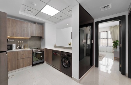 Discovery Gardens Apartamento | Maison Privee - Tranquil Escape w/ Balcony and High-End Facilities