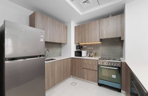 Discovery Gardens Apartamento | Maison Privee - Tranquil Escape w/ Balcony and High-End Facilities