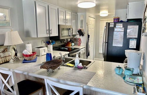 Point East Condominio | Master suite KING SIZE bed, Guest Bedroom two FULL SIZE beds. BIG Discounts!