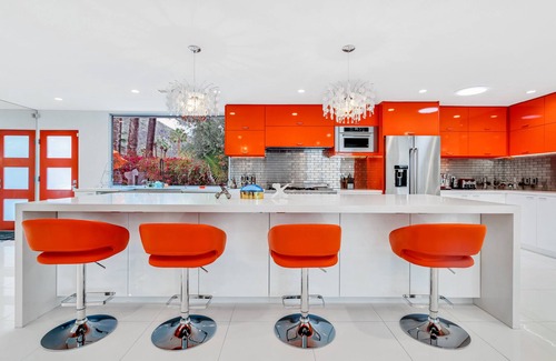 Historic Tennis Club Casa | Mid-century modern estate with a pool, hot tub, gourmet kitchen, and fireplace