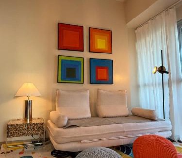 Tambo Apartamento | Modern 1BR with Balcony Facing Infinity Pool Manila Bay Sunset Near Airports OKADA Solaire MOA