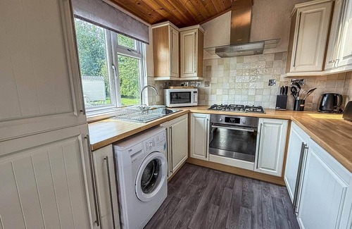 Hunstanton Cabina | Modern 4 berth lodge with decking at Manor Park in Hunstanton ref 23024W