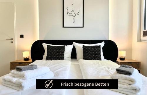 Rauental Apartamento | Modern Apartment - für Freunde & Familien, stadtnah, Parkplatz, E-Ladestation, Gitterbox für Fahrräder, Fitnessstudio, digitale Gästemappe mit Restaurant- und Unternehmenstipps