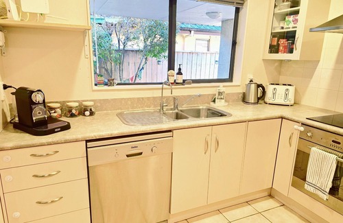 Clive Casa | Modern Family Oasis in Clive Spacious fully furnished 3 bdrm home w/ AC.
