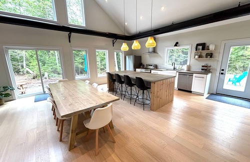 Lion's Head Casa | Modern forest retreat in Stokes Bay! Featuring king beds, cozy bunk rooms, a spacious game loft, firepit, chef’s kitchen, and open-concept living. Perfect for families and groups—close to Bruce Peninsula hiking, beaches, and dark sky stargazing.