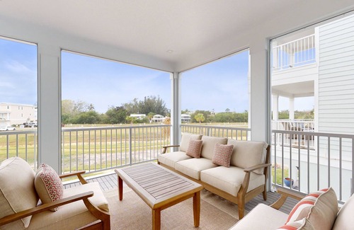Cortez Casa | Modern home with screened-in balcony, pool, bikes, & EV charger - great location