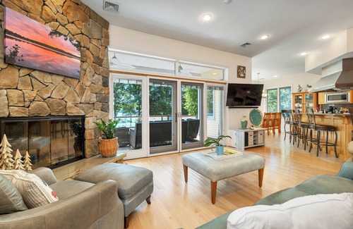 Laconia Casa | Modern Lake Opechee Home features Sandy Perched Beach and Dock