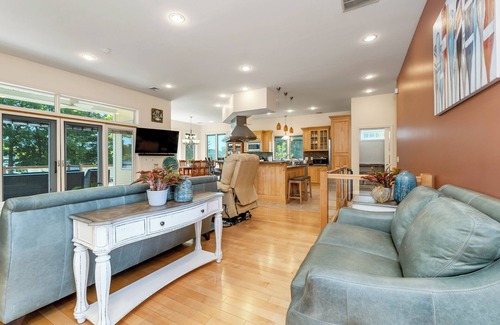 Laconia Casa | Modern Lake Opechee Home features Sandy Perched Beach and Dock
