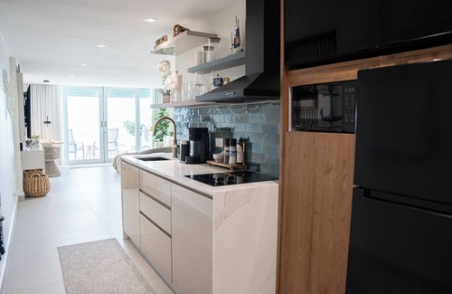 Cabezas Apartamento | Modern Oceanfront Oasis All-New Furniture & Appliances