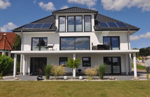 Ponitz am See Apartamento | Modern, relaxing vacation apartment (2 pers) directly on the lake, sub board + bicycles
