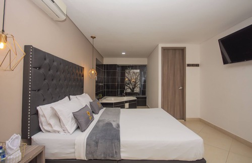 Bello Hotel | Habitación Deluxe con bañera hidromasaje en Bello