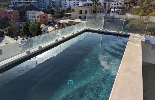 Libertad Condominio | Modern, spacious condo w/ pool. Close to Downtown.