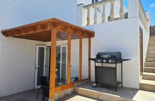 Tinajo Casa | Estudio acogedor con impresionantes vistas costeras, balcón y barbacoa en Tinajo